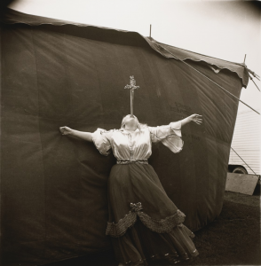 Albino Sword Swallower At A Carnival